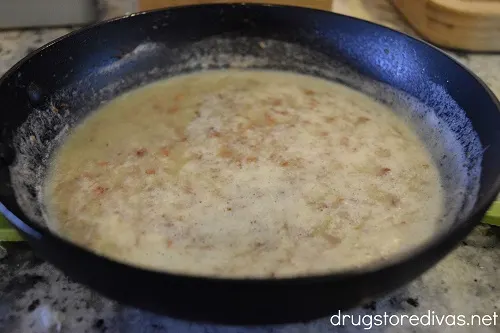 Coagulated smoked garlic butter in a pan.