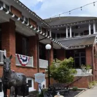 An outside shot of The Belmont Inn by OYO with the words 