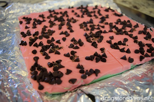 Watermelon Fudge being cut into pieces.