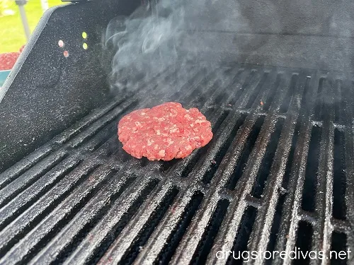 A burger on a grill.