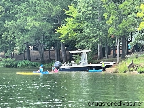 Two kayaks and a boat in the water at Lake Greenwood State Park.
