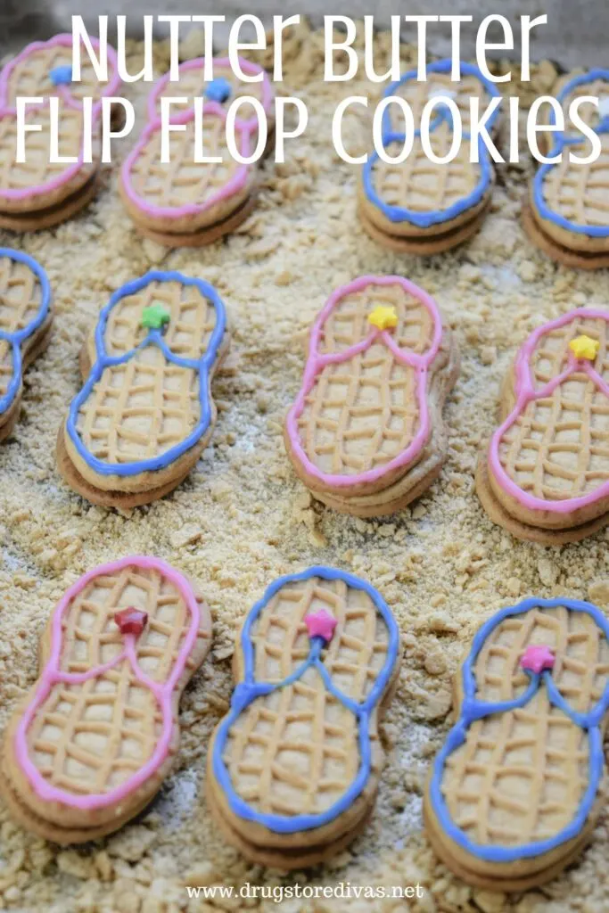 Flip Flop cookies on graham cracker sand with the words "Nutter Butter Flip Flop Cookies" digitally written on top.