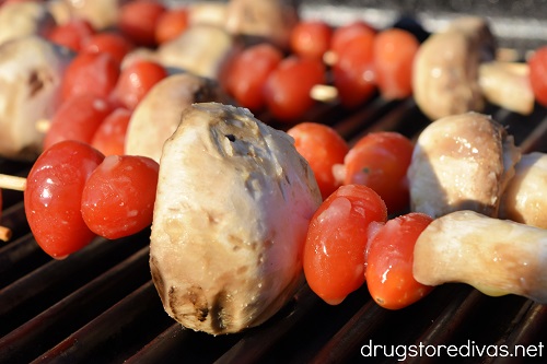 Tomato and mushroom skewers on the grill.