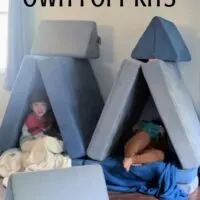 Two kids in pillow forts with the words 