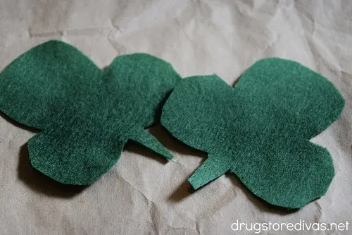 Two green leaves cut out of felt.