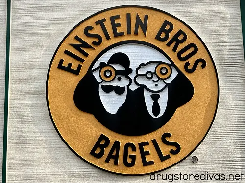 The Einstein Bros Bagels logo on a wall.