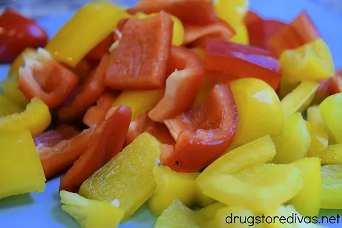Cut pieces of red and yellow peppers.