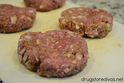 Four burger patties.