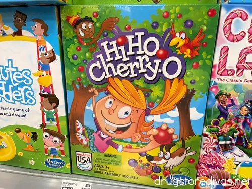 Board games on a shelf with Hi Ho Cherry-o in the middle.