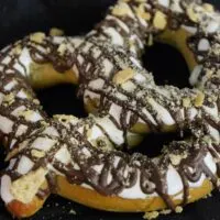 A s'mores pretzel on a napkin with the words 
