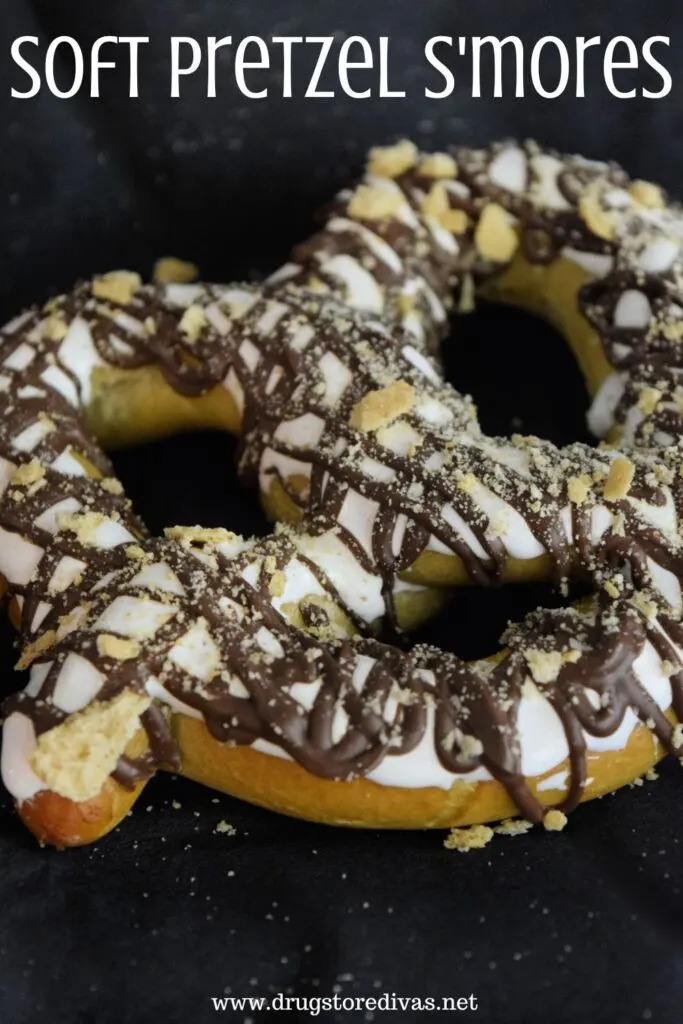 A s'mores pretzel on a napkin with the words "Soft Pretzel S'mores" digitally written on top.