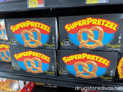 Four boxes of SUPERPRETZEL pretzels on a shelf in a store's freezer section.