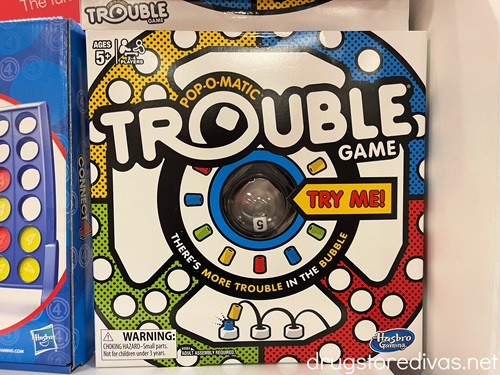 A Trouble board game on the shelf in a store.