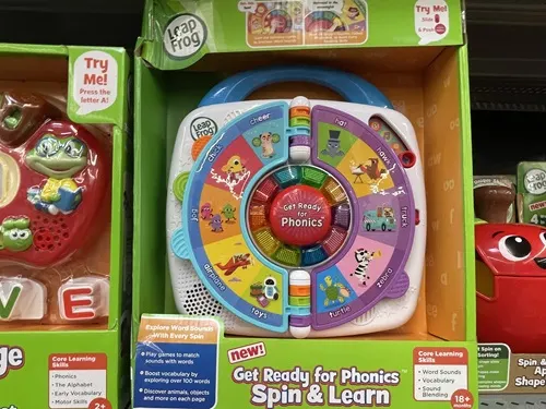 A LeapFrog Get Ready for Phonics Spin & Learn in the box on a shelf.