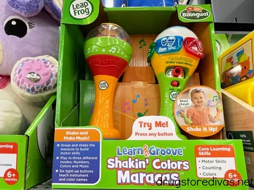A pair of LeapFrog Learn & Groove Shakin' Colors Maracas in a box on a shelf.