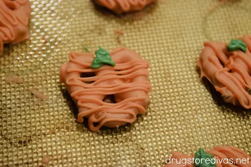 Mini pretzel twists decorated to look like pumpkins.