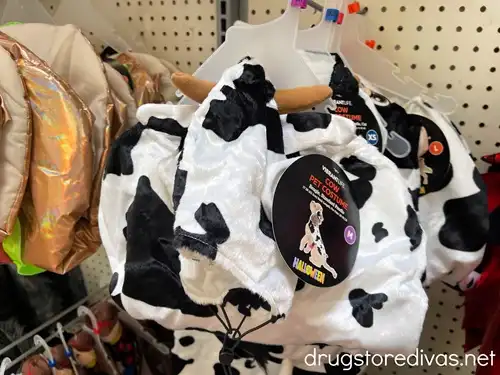 A cow pet costume on a shelf in the store.