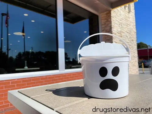 A ghost Boo Bucket on a table outside McDonalds.