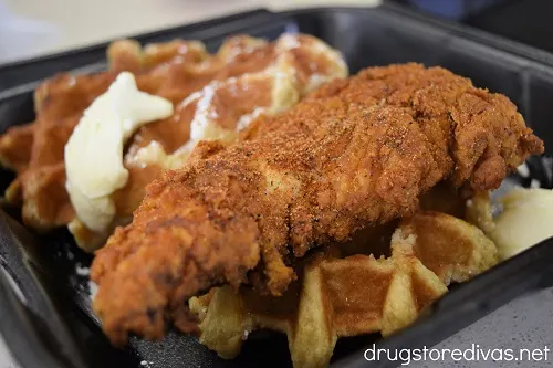 Two waffles and a chicken tender.