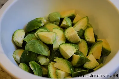Quartered Brussels sprouts in a bowl.