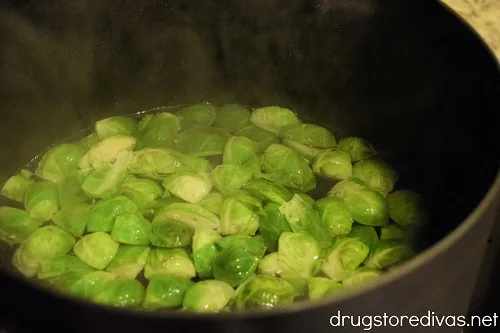 Brussels sprouts in a pot of boiling water.