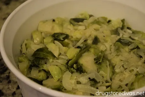 Vegetarian Brussels sprouts casserole ingredients in a casserole pan.