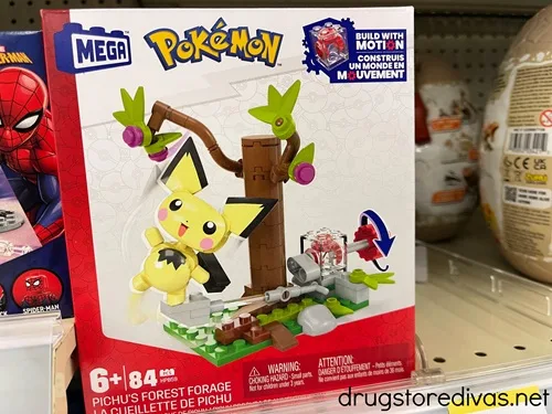 A Mega-brand Pokemon building toy, of a Pichu character in a tree, on a shelf in a store.