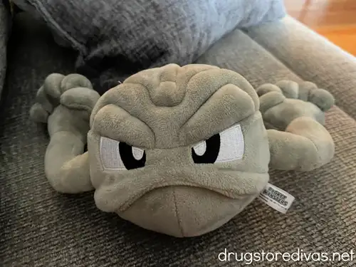 A stuffed animal that's shaped like the Pokemon named Geodude.