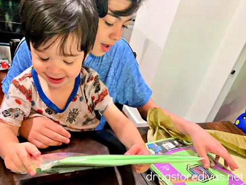 Two boys at a table with Chalk of the Town shirts.