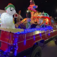 A truck with lights during the lighted parade in Union Gap with the words 