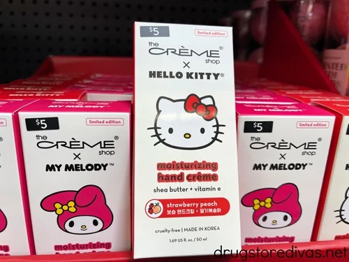Boxes of The Creme Shop X Hello Kitty and My Melody hand cream on a shelf.
