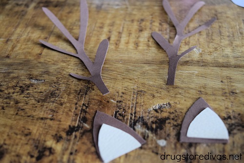 The ears and antlers for a reindeer cut out of card stock.