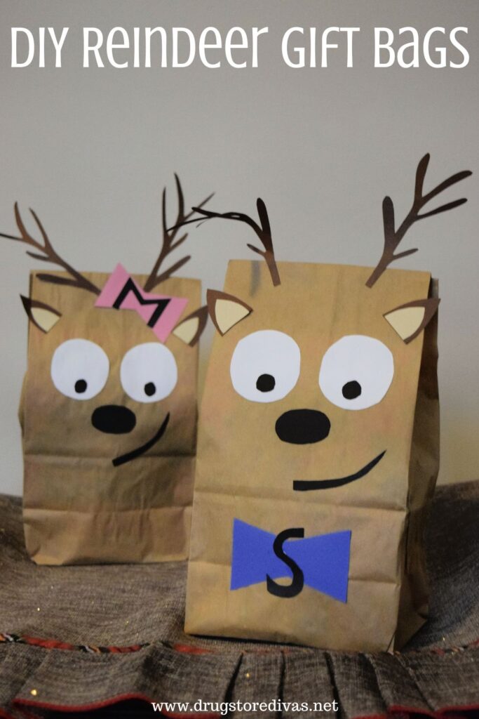 Two gift bags made to look like reindeer with the words "DIY Reindeer Gift Bags" digitally written above them.