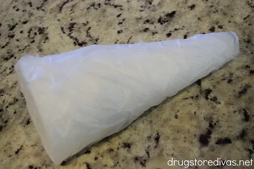 A foam cone wrapped in cling wrap.