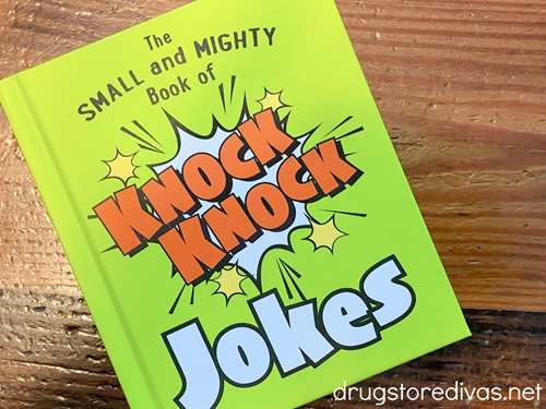 A neon green book called "The Small And Mighty Book Of Knock Knock Jokes".