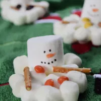 Three marshmallow snowmen with the words 