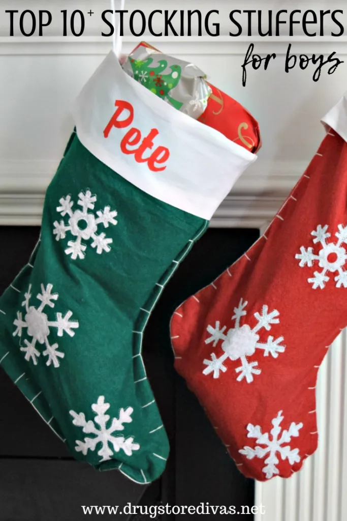 Two stockings hanging, a green one that says Pete and a red one, with the words "Top 10+ Stocking Stuffers For Boys" digitally written above it.