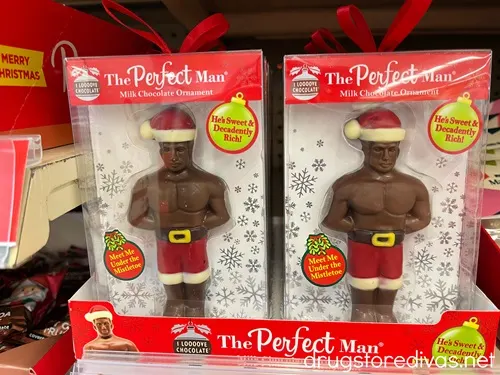 Two boxes with chocolate men in boxers and Santa hats with the words The Perfect man written on the box on a shelf.