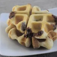 Two croffles on a plate with the words 