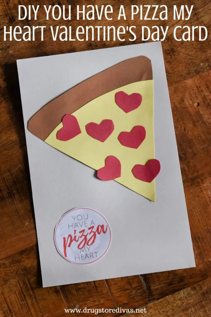A handmade card with a card stock pizza on it with the words "DIY You Have A Pizza My Heart Valentine's Day Card" digitally written on top.