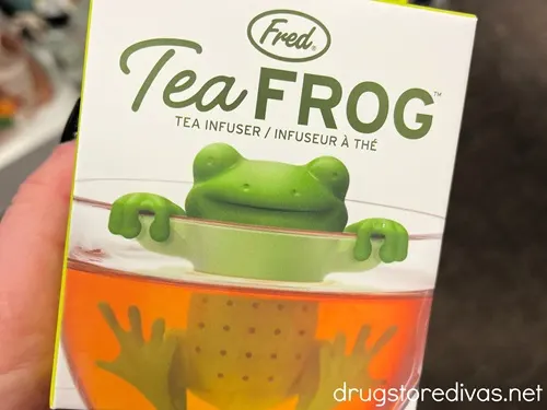 A frog shaped tea infuser in a box.