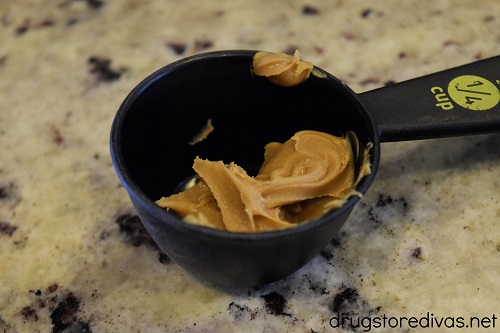 Peanut butter in a measuring cup.
