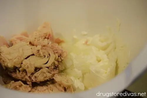 Tuna, cream cheese, and onion in a bowl.