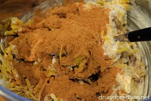 Taco seasoning on top of ingredients in a bowl.
