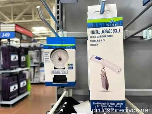 Luggage scales hanging on a rack in Walmart.