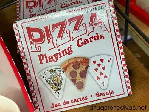 A deck of playing cards where the cards are shaped like pieces of pizza.