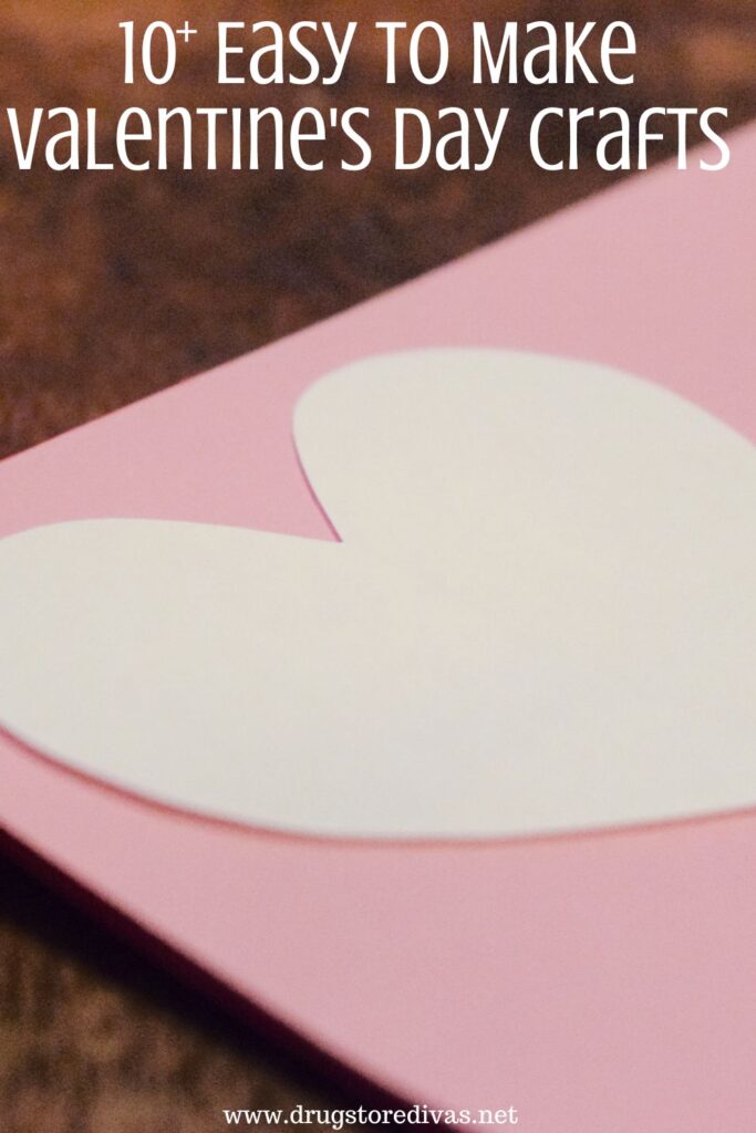 A white heart on top of a pink piece of cardstock with the words "10+ Easy To Make Valentine's Day Crafts" digitally written on top.
