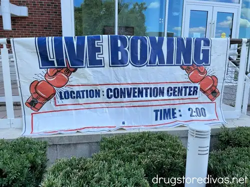A sign advertising live boxing at the Wilmington Convention Center during the North Carolina Azalea Festival in Wilmington, North Carolina.