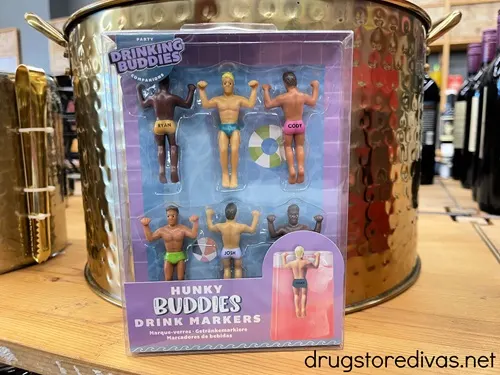 A box of Hunky Buddy drink markers on a shelf.