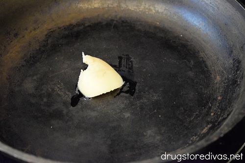 A pat of bacon fat in a pan.